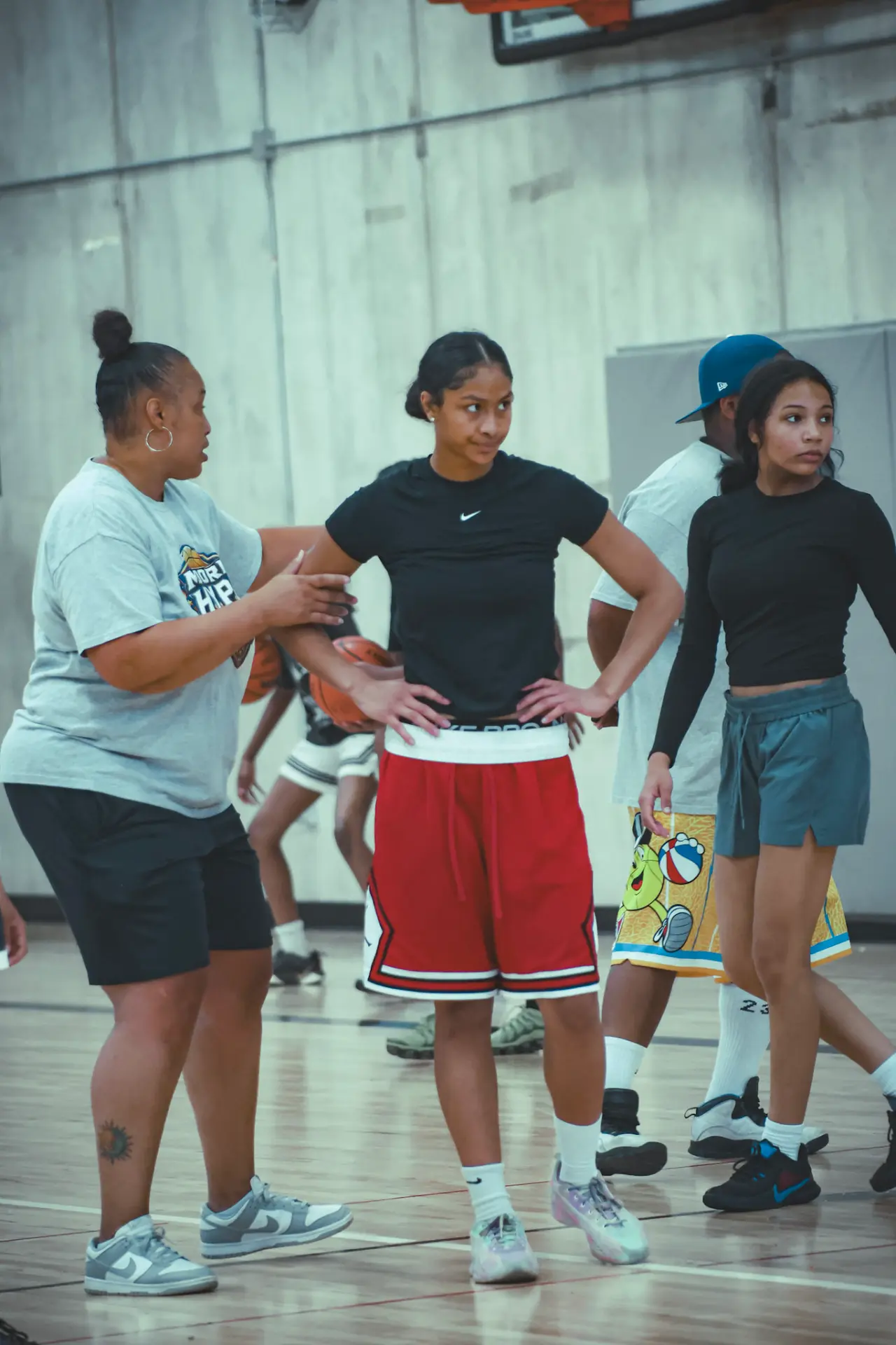 Coach working with athletes during a Moore H.Y.P.E. drill